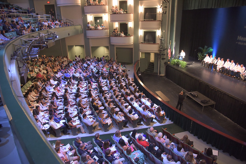 students in an auditorium.