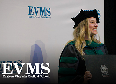 Haley Kearns holds her diploma during the EVMS Commencement ceremony	